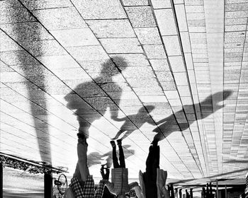 People standing on bridge