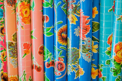Full frame shot of colorful floral pattern plastic rolls at store