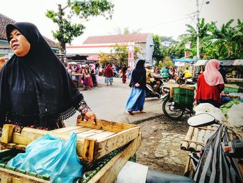 People at market stall