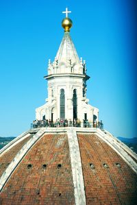 Low angle view of church against blue sky