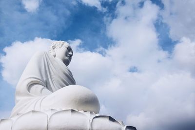 Low angle view of statue against sky