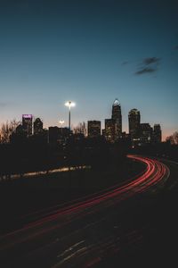 Light trails on road in city at night