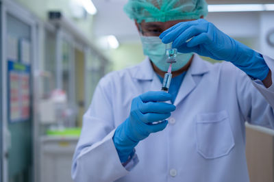 Midsection of person working in office