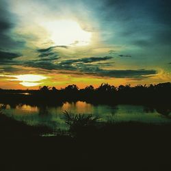 Scenic view of sunset over lake