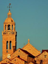 Low angle view of building against clear blue sky