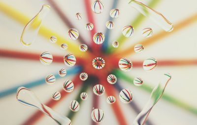 Close-up of water drops on glass plate