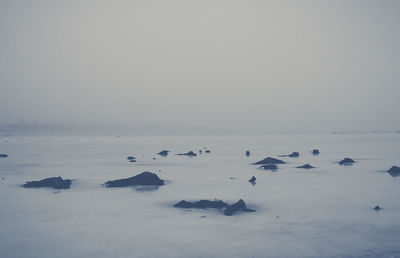 Scenic view of frozen lake against sky
