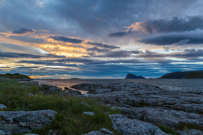 Scenic view of sea against dramatic sky