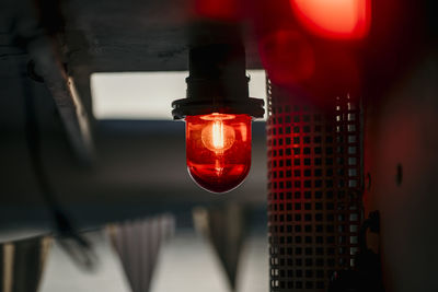 Illuminated lighting equipment hanging on ceiling on boat