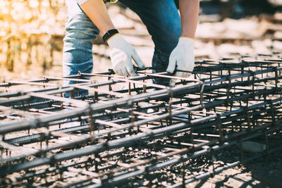 Low section of man working at construction site