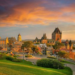 View of cityscape against cloudy sky