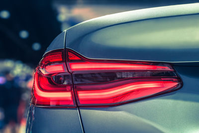 Close-up of red car on side-view mirror