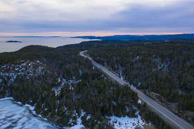 Scenic view of landscape against sky during winter