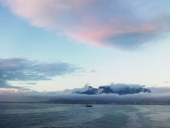 Scenic view of sea against cloudy sky