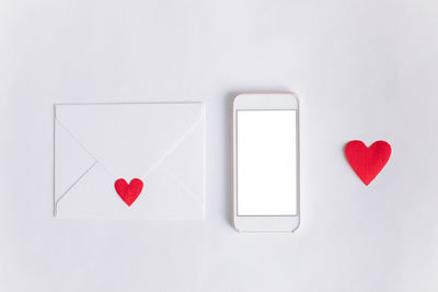 Directly above shot of heart shape over white background