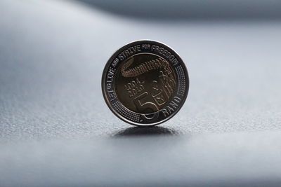 Close-up of coin against black background