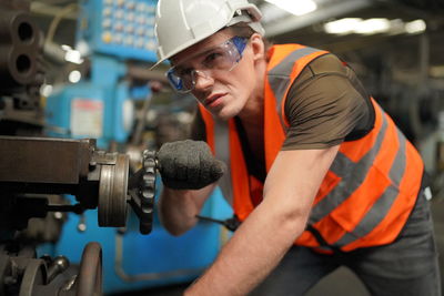 Side view of man working in gym