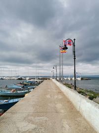 Pier over sea against sky