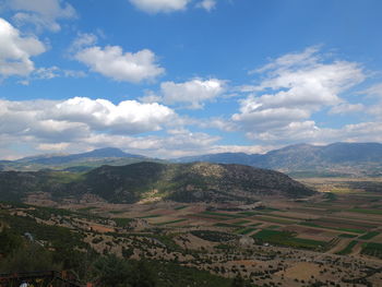 Scenic view of agricultural field against sky