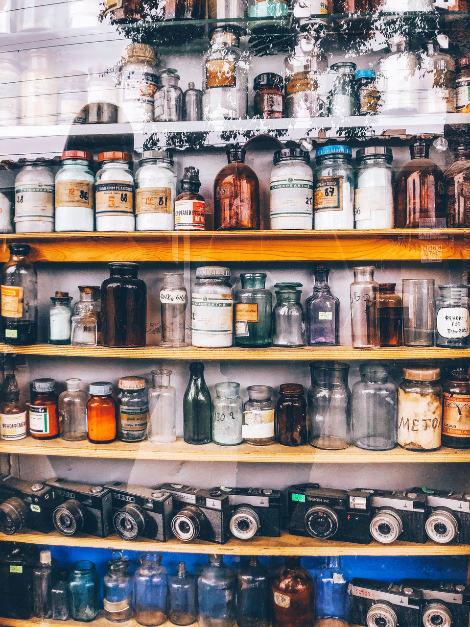 FULL FRAME SHOT OF BOTTLES IN GLASS