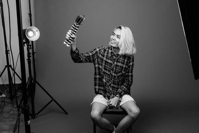 Portrait of woman with illuminated lighting equipment