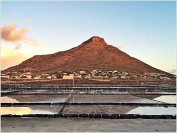 Built structure against mountain range