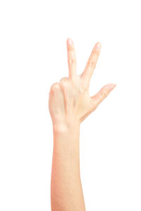 Close-up of human hand against white background