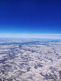Scenic view of dramatic landscape against clear blue sky