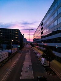 View of city street and buildings against sky