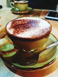 Close-up of cappuccino on table