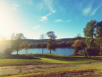 Scenic view of lake against sky at sunset