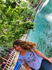 Woman standing by plants