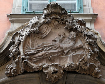 Low angle view of statue against building