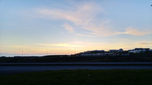 Road on field at sunset