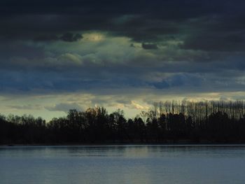 Scenic view of landscape against sky at dusk