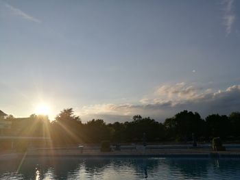 Scenic view of trees against sky during sunset