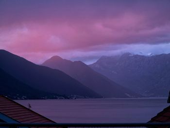 Scenic view of mountains against sky at sunset