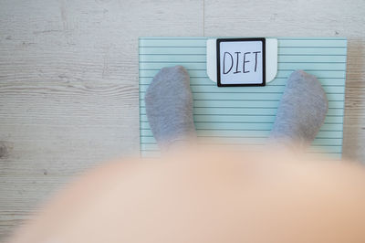 Close-up of sign on floor at home