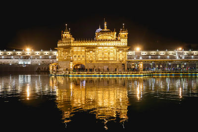 Reflection of illuminated buildings in water at night