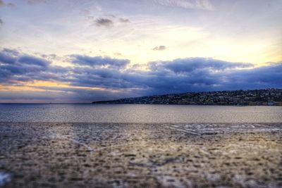 Scenic view of beach against sky during sunset