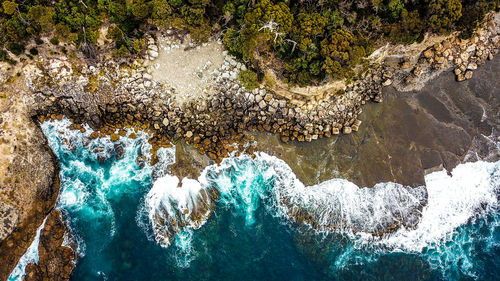 High angle view of rocks in sea