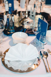 Close-up of wine glasses on table in restaurant