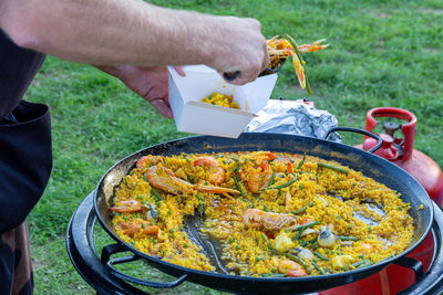 Midsection of man preparing food
