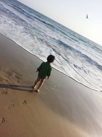 Full length of boy on beach
