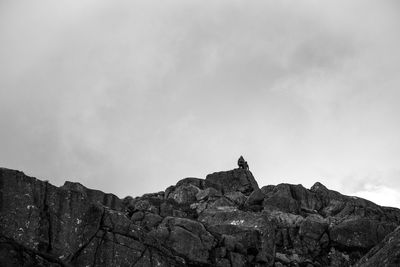 Low angle view of rock formation against sky