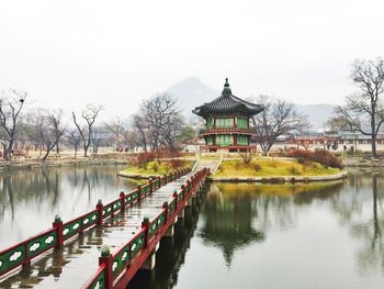 Traditional building on lake during autumn