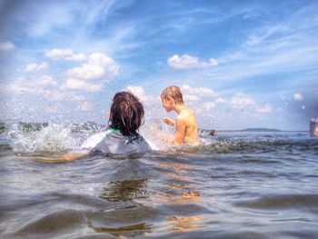 Woman swimming in sea