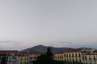 Houses in city against sky