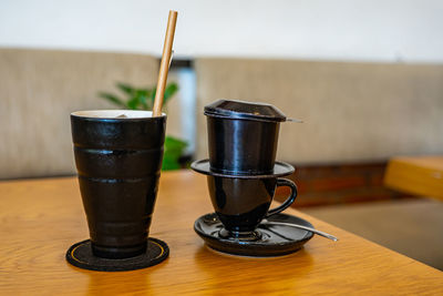 Close-up of coffee cup on table