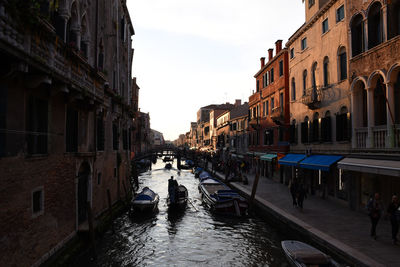 Canal passing through city buildings